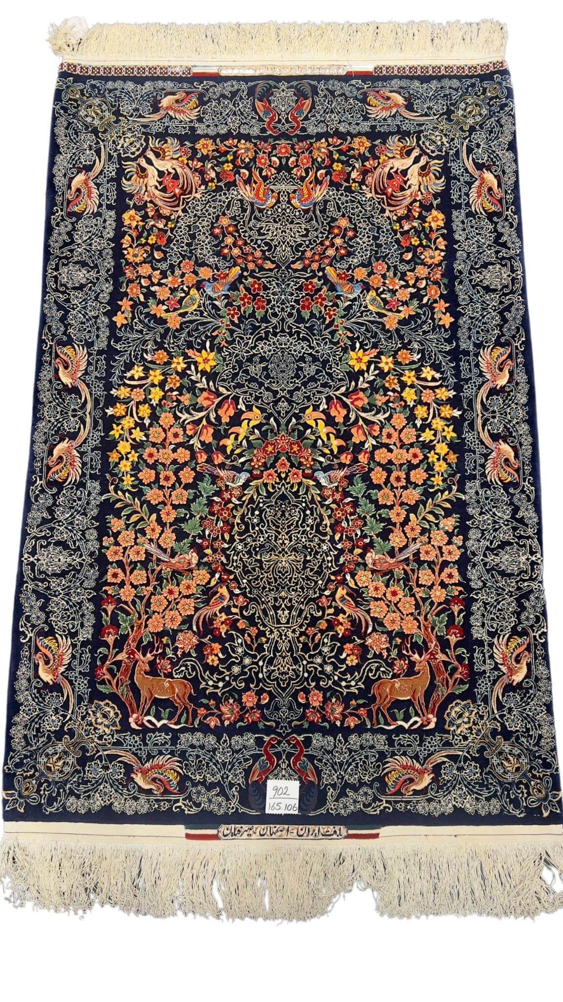 Hand-knotted Seirafian rug featuring deer, florals, and birds in a vibrant design.